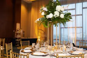 Classic, Elegant Tall Gold Flower Stand Centerpieces with Monstera, Palms, White Roses and Hydrangeas | Tropical White and Gold Wedding Reception Ideas