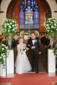 Bride and Groom Just Married Wedding Portrait | Tall White Rose and Greenery Wedding Ceremony Aisle Floral Arrangements | Tampa Bay Planner Parties A La Carte