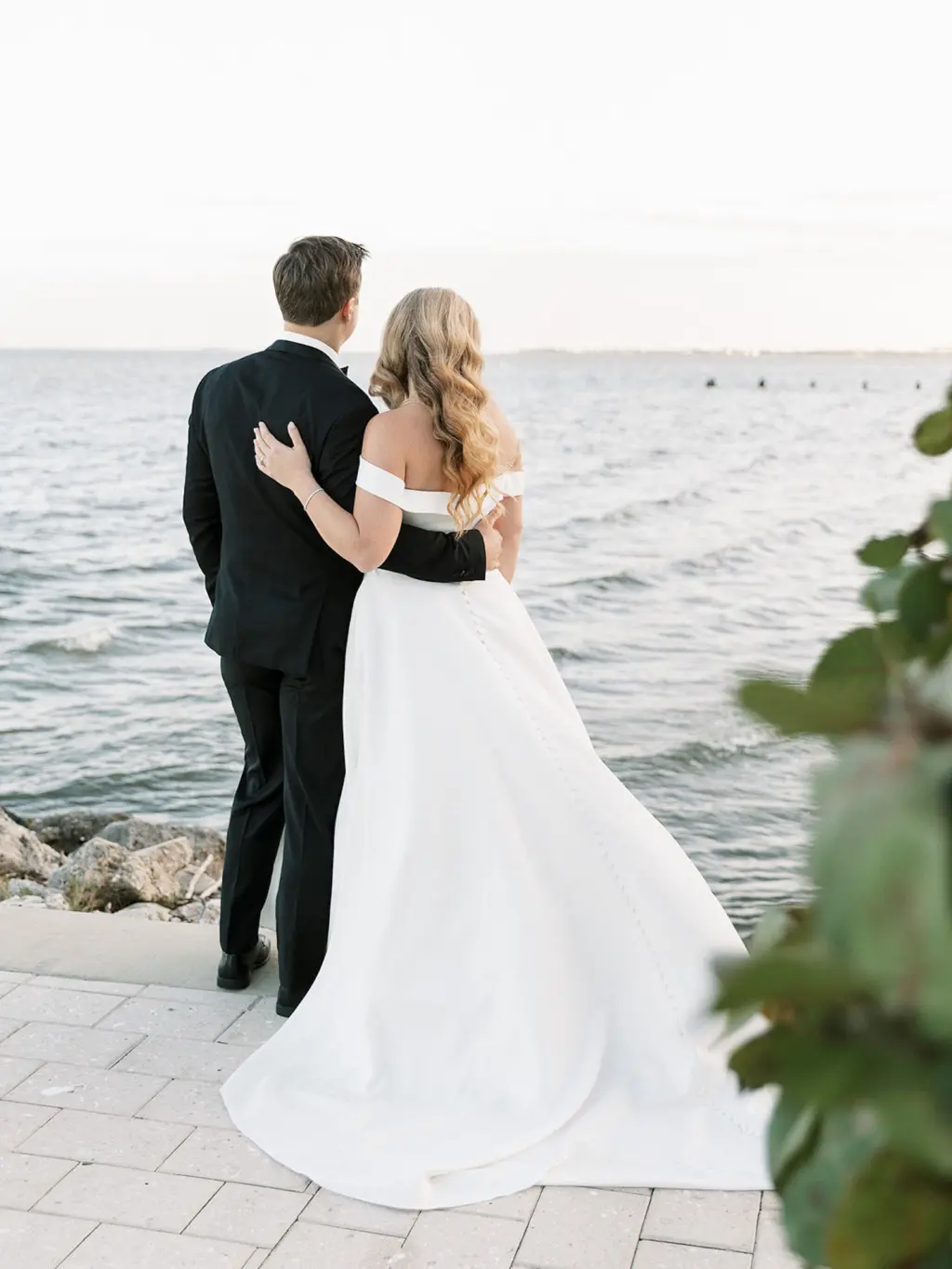 Bride and Groom Looking Out into the Water Sunset Wedding Portrait | South Tampa Venue Tampa Yacht and Country Club | Planner EventFull Weddings