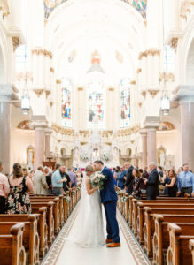 Wedding Ceremony Aisle Kiss | Sacred Heart Catholic Church Downtown Tampa | Photographer Dewitt for Love | Videographer Shannon Kelly Films