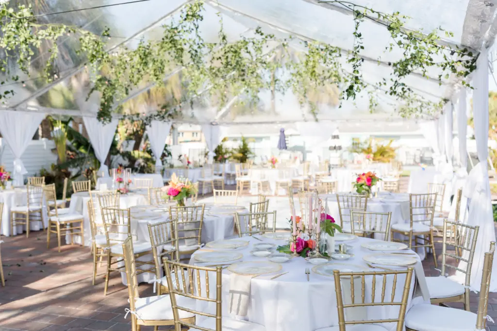 Tented Tropical Beach Wedding Reception Ideas with Greenery and Pops of Color | Gold Chiavari Chairs with White Linen Rounds | Sarasota Planner MDP Events | Florist Save the Date Florida
