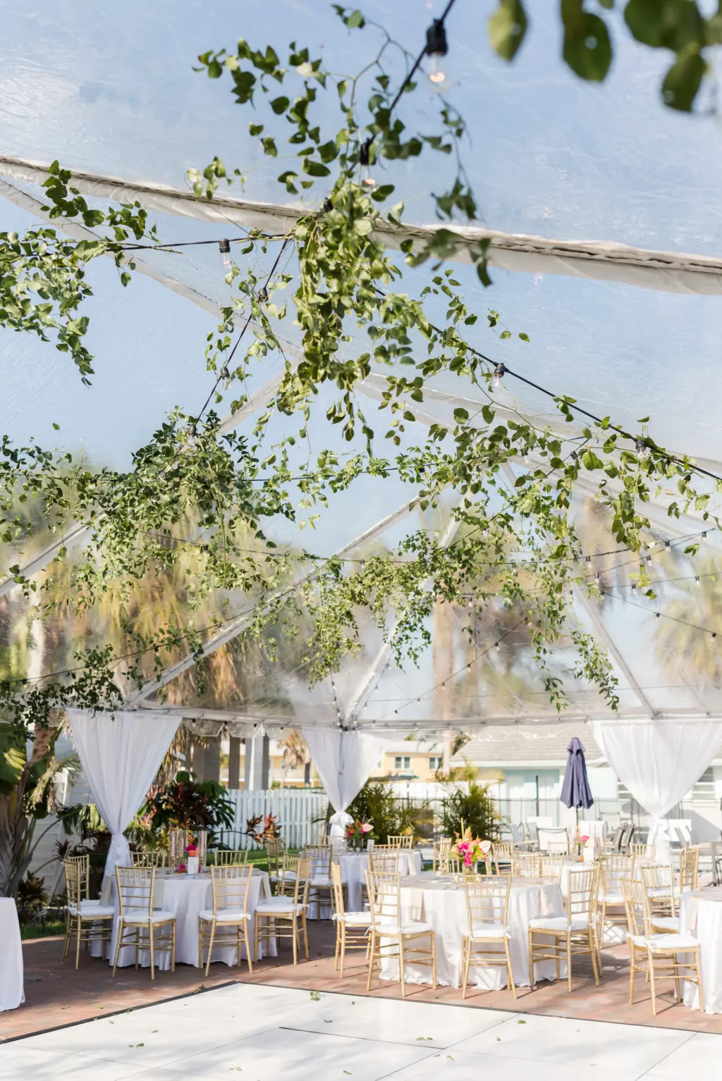 Tented Tropical Beach Wedding Reception Ideas with Greenery and Pops of Color Greenery Detailing | Sarasota Planner MDP Events | Florist Save the Date Florida