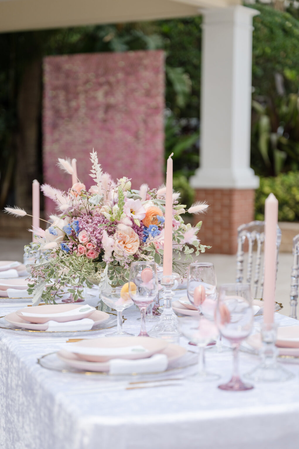 Spring Garden Purple, Orange and Pink Roses, Blue Stock Flowers, and Greenery Centerpieces | Gold Flatware with Gold-rimmed Chargers and Blush Plate | Whimsical Garden Wedding Reception Inspiration | Sarasota Planner MDP Events | Florist Save The Date Florida