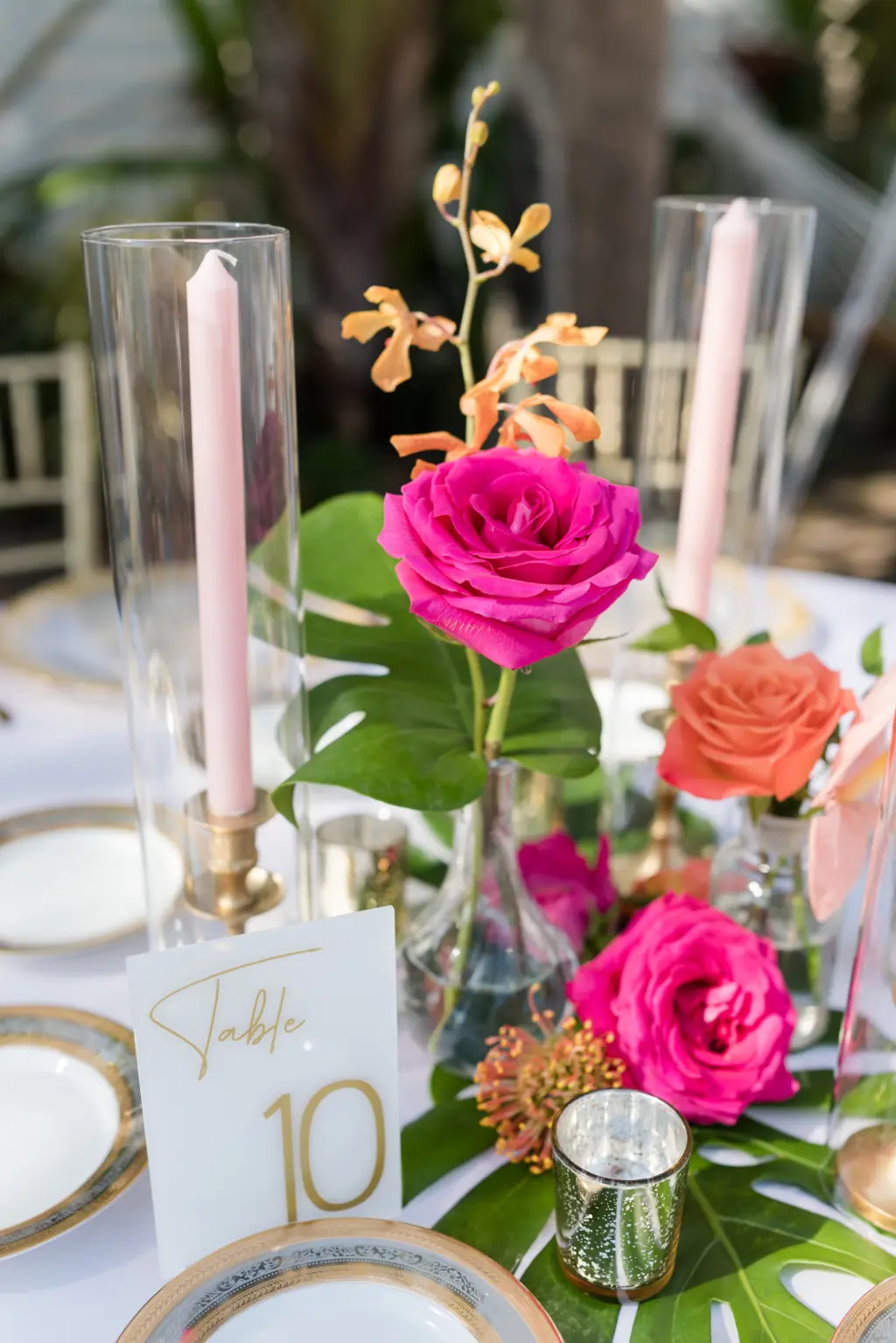 Tropical Hot Pink and Orange Floral Centerpieces with Monstera and Greenery Detailing Centerpiece Inspiration | Sarasota Florist Save the Date Florida