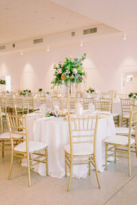 Tall Gold Flower Stand with Greenery and Roses Centerpiece Inspiration | Gold Chiavari Chairs Seating Ideas | Tampa Bay Kate Ryan Event Rentals