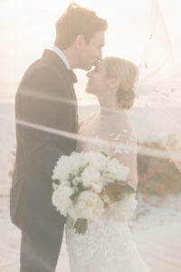 Bride and Groom Romantic Sunset Veil Wedding Portrait on Clearwater Beach | Tampa Bay Planner Parties A La Carte