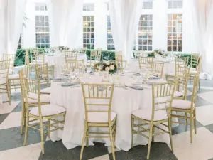 Round Table with Gold Chiavari Chairs | Blue Embroidered Napkins | Old Florida Blue and White Wedding Reception Ideas | Tampa Bay Rentals Gabro Event Services