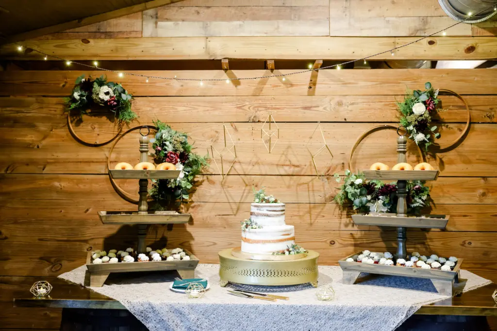 Round Two-tiered Semi-Naked Wedding Cake | Cupcake and Donut Dessert Alternatives | Gold Geometric Wedding Reception Decor Ideas