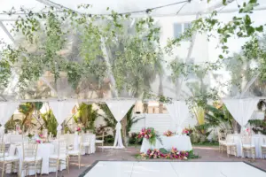 Tented Tropical Beach Wedding Reception Ideas with Greenery and Pops of Color | White Dance Floor with Sweetheart Table | Sarasota Florist Save the Date Florida