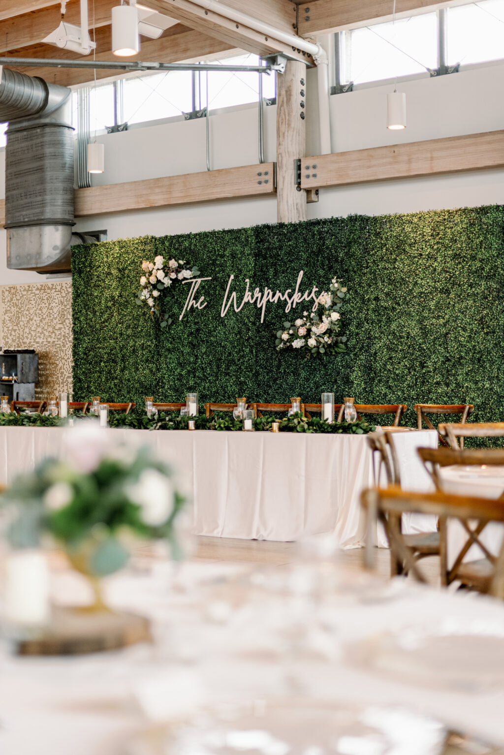 Grass Wall with Personalized Name Backdrop for Head Table | Rustic Wedding Reception Inspiration | Tampa Bay Kate Ryan Event Rentals