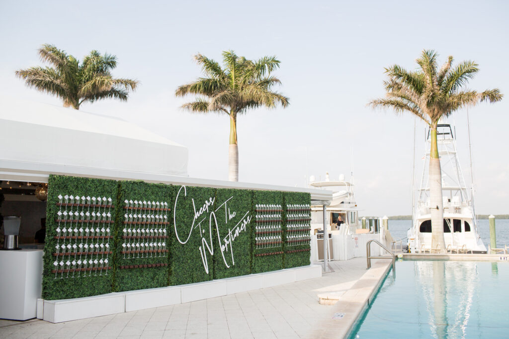 Cheers Greenery Champagne Wall for Wedding Pool Cocktail Hour Inspiration | Clearwater Venue Carlouel Beach & Yacht Club