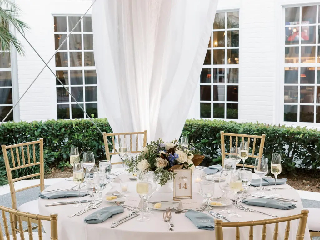 Round Table with Gold Chiavari Chairs | Blue Embroidered Napkins | Blue and White Wedding Reception Ideas | Tampa Bay Rentals Gabro Event Services