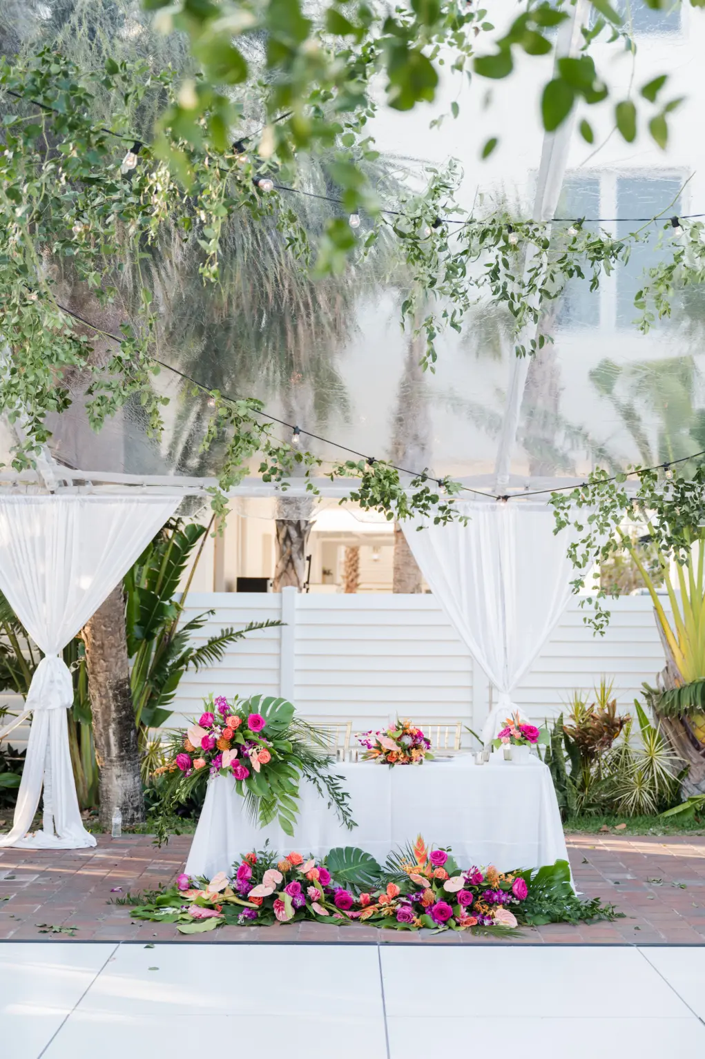 Sweetheart Tropical Tablescape with Bright Floral Decor Inspiration In Tented Reception | St. Petersburg Wedding Florist Save the Date Florida
