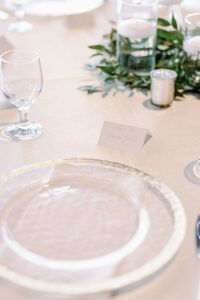 Elegant Gold Rimmed Chargers with Place cards for Wedding Reception | Tampa Bay Kate Ryan Event Rentals