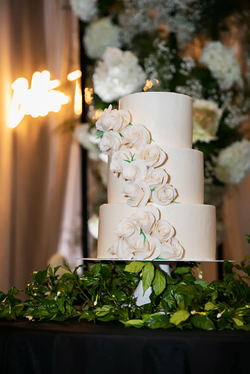 Round Three-tiered Wedding Cake with Cascading Fondant Flowers