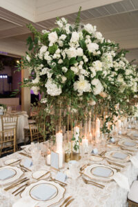 Tall Gold Flower Stand with White Flowers and Greenery Centerpiece Ideas | Timeless Candlelit Wedding Reception | Tampa Bay Rentals A Chair Affair | Planner Parties A La Carte