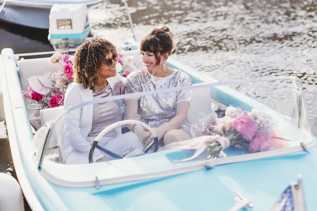 Same Sex Couple in Getaway Boat Elopement with Cotton Candy Color Inspiration | Downtown Tampa Florida Wedding Planner Wilder Mind Events