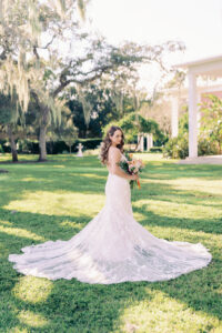Ivory and Nude Deep V Neckline Lace Fit and Flare Enzoani Wedding Dress with Chapel Length Train Ideas | Venue Tampa Garden Club | Planner Kelly Kennedy Weddings and Events