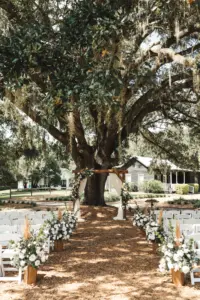 Oak Tree Wedding Ceremony Inspiration | White and Blush Roses with Pampas Grass Aisle Floral Arrangement Ideas | Tampa Bay Florist Monarch Events and Design | Venue Cross Creek Ranch