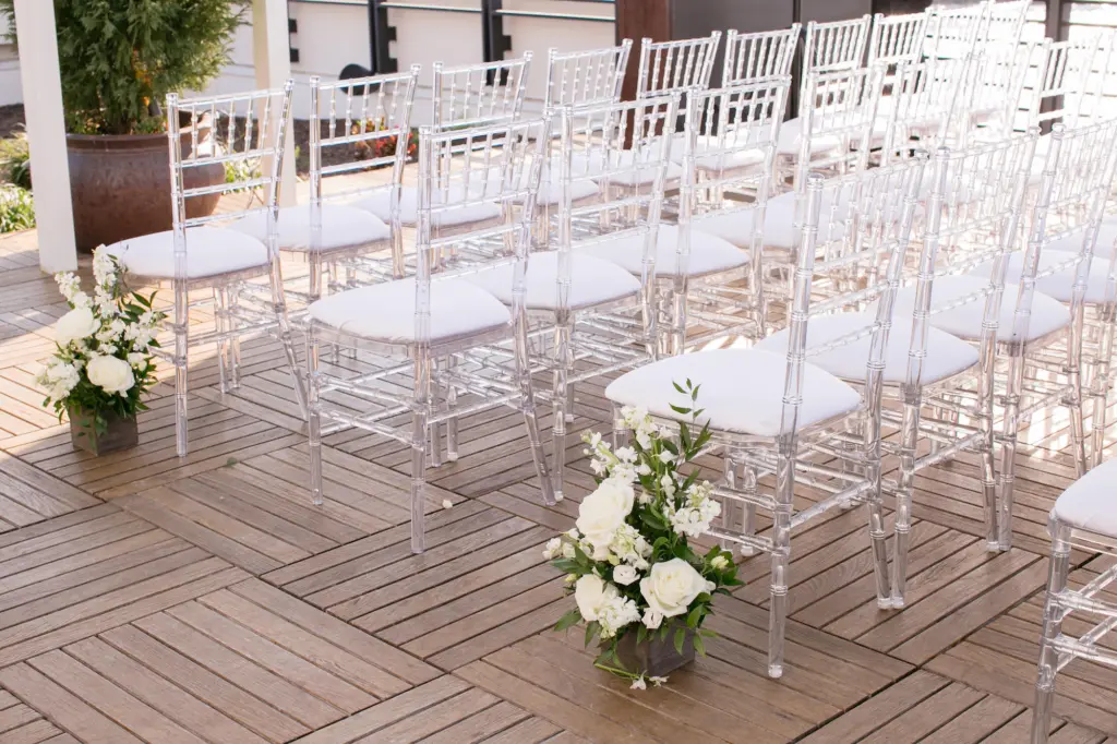 White Roses, Stock Flowers, and Greenery Wedding Ceremony Aisle Decor Ideas | Clear Chiavari Chairs | Tampa Bay Kate Ryan Event Rentals