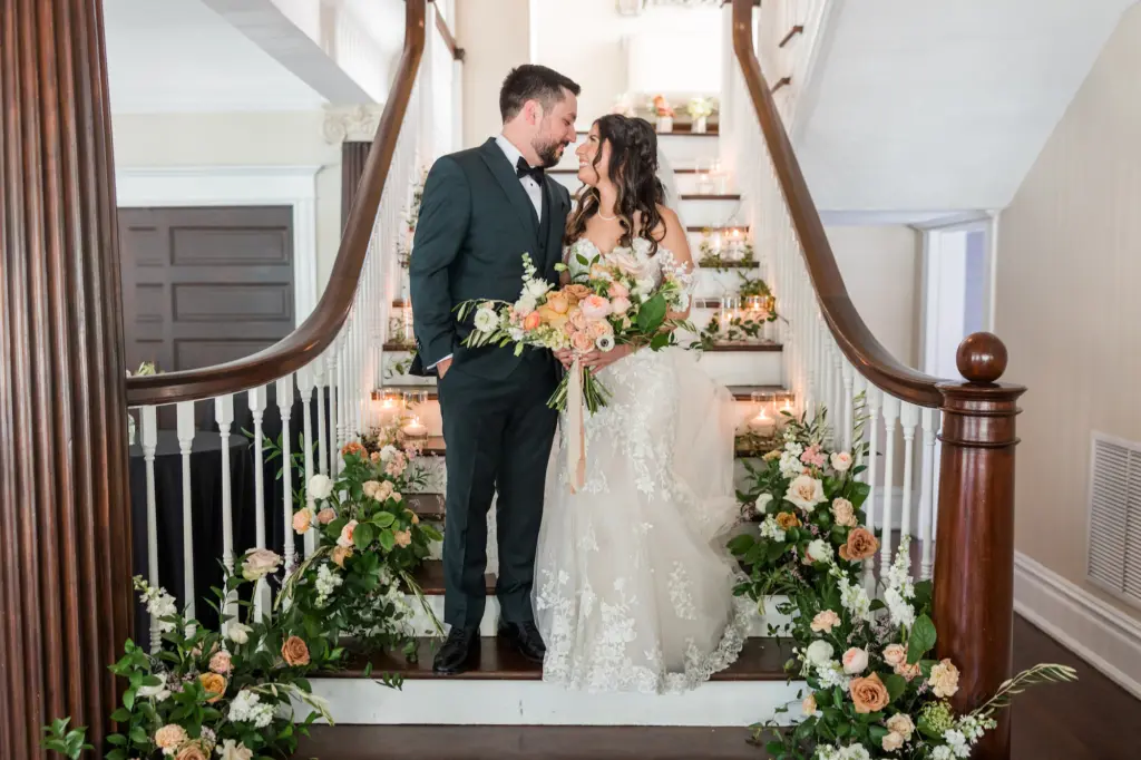 Bride and Groom First Look Wedding Portrait on Staircase with Peach and Cream Florals in Greenery | Tampa Florida Wedding Portrait Mary Anna Photography | Venue The Orlo