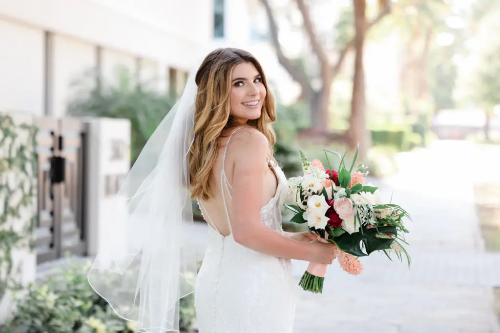 Half Up Half Townd Bridal Makeup and Hair Look | Bridal Portrait with Layered Veil Holding Tropical Inspired Wedding Floral Bouquet | St. Petersburg Wedding Photographer Lifelong Photography | St. Pete Hair and Makeup Artist Femme Akoi