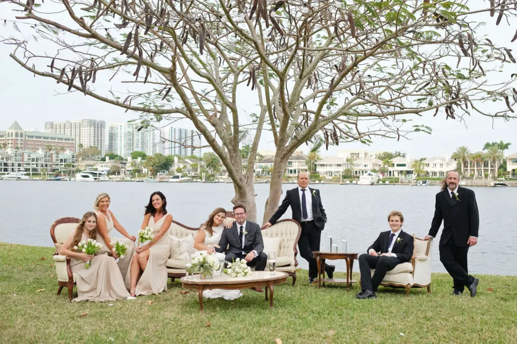 Waterfront Bridal Party Wedding Portrait | Cream Beige Bridesmaids Dresses | Groomsmen in Black Suits and Ties Ideas | Tampa Wedding Planner The Olive Tree Weddings | Venue Davis Island Garden Club
