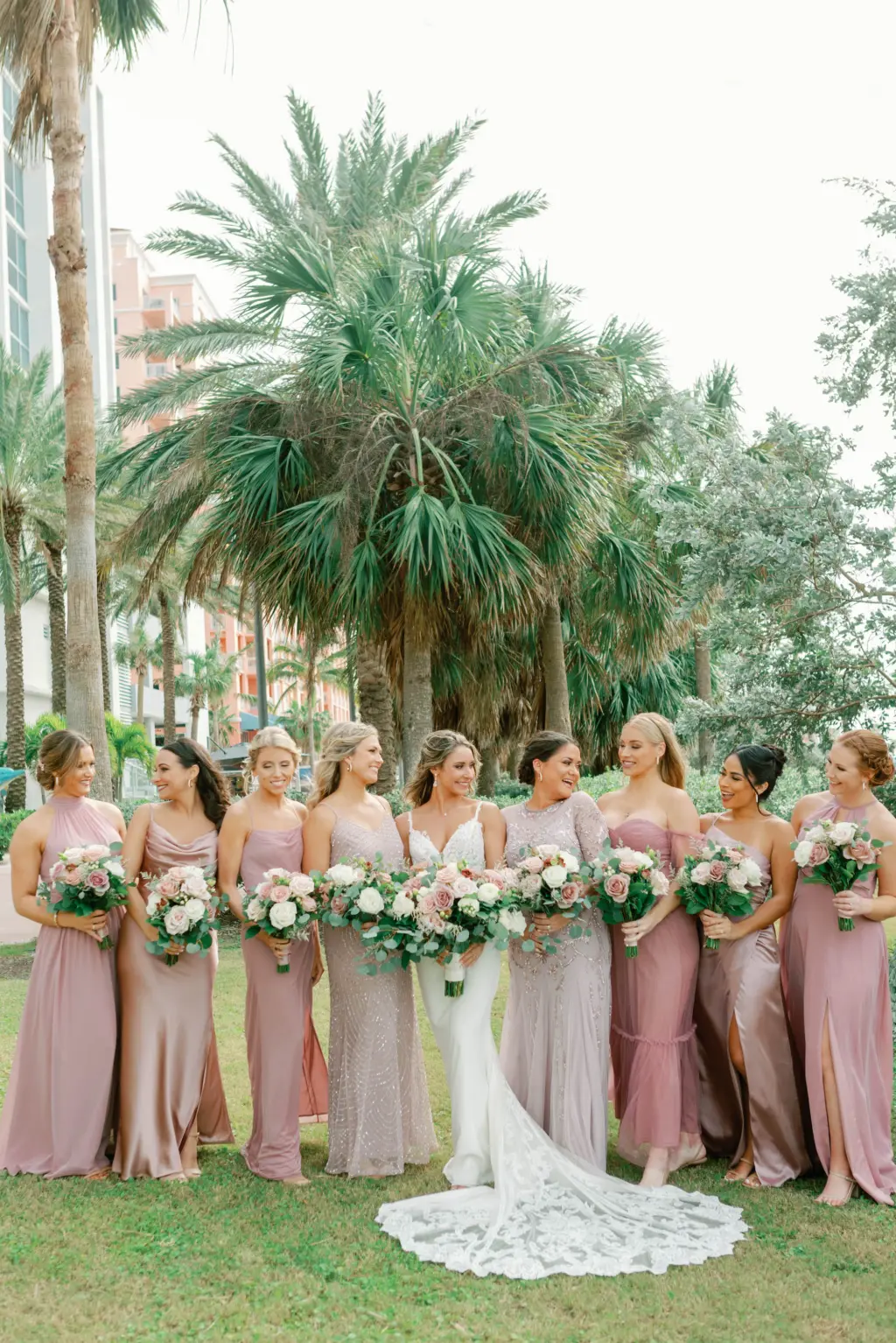 Bride with Bridesmaids in Pastel Pink Mauve Mix and Match Bridesmaids Dresses Wedding Portrait Ideas