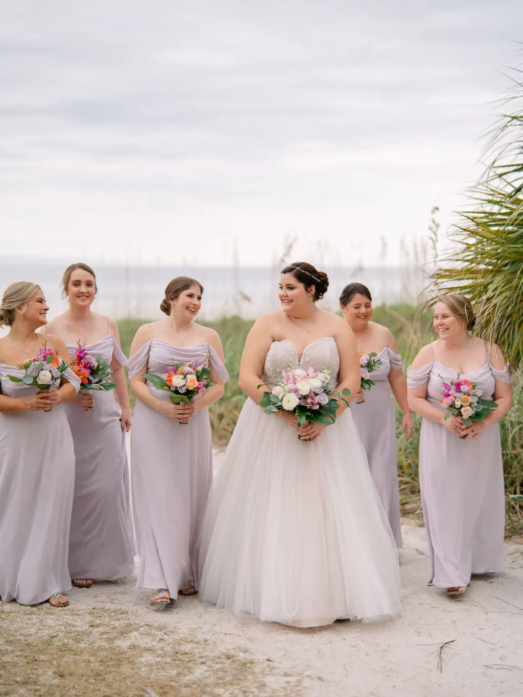Bride with Bridesmaids in Pastel Purple Spring Wedding Dress Inspiration