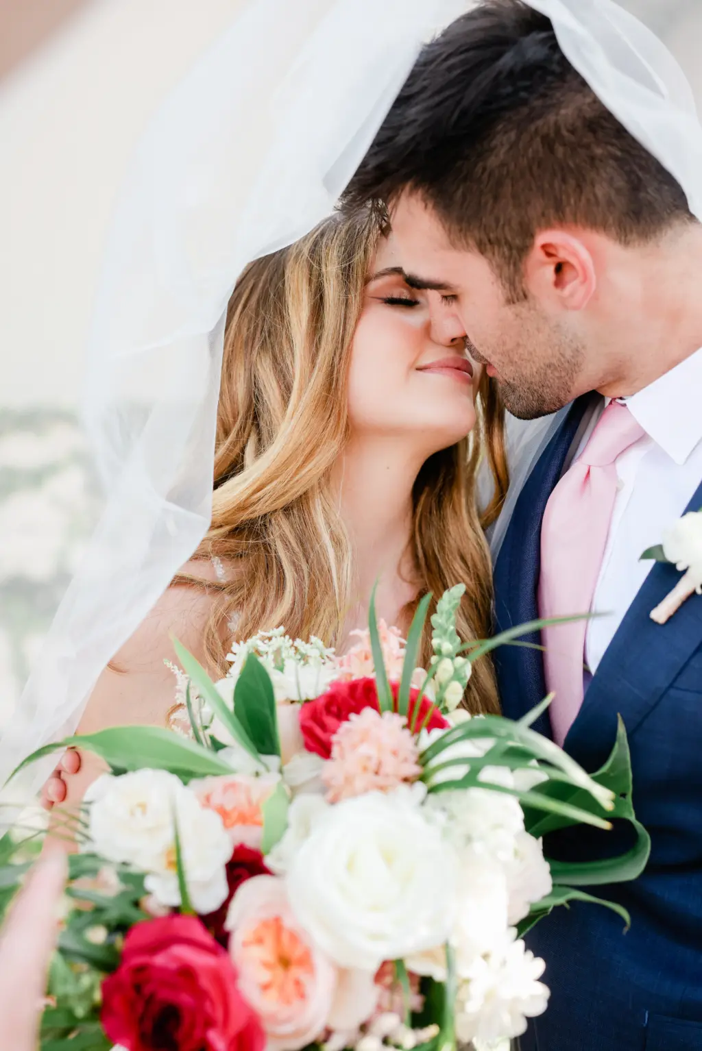Bride and Groom Up Close Wedding Portrait Under Veil with Tropical Florals | Wedding Photographer St. Petersburg Lifelong Photography | Planner Coastal Coordinating