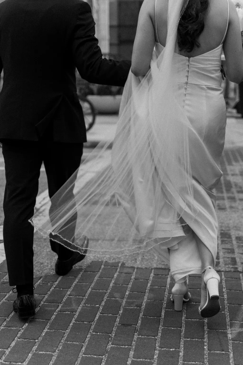 Bride and Groom Walking Through Downtown Tampa Wedding Portrait | Tampa Bay Photographer and Videographer J & S Media
