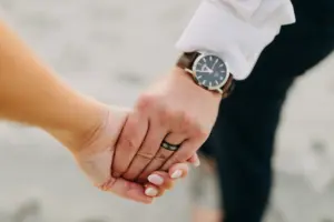 Bride and Groom Holding Hands | Silver Tungsten Wedding Band Ideas