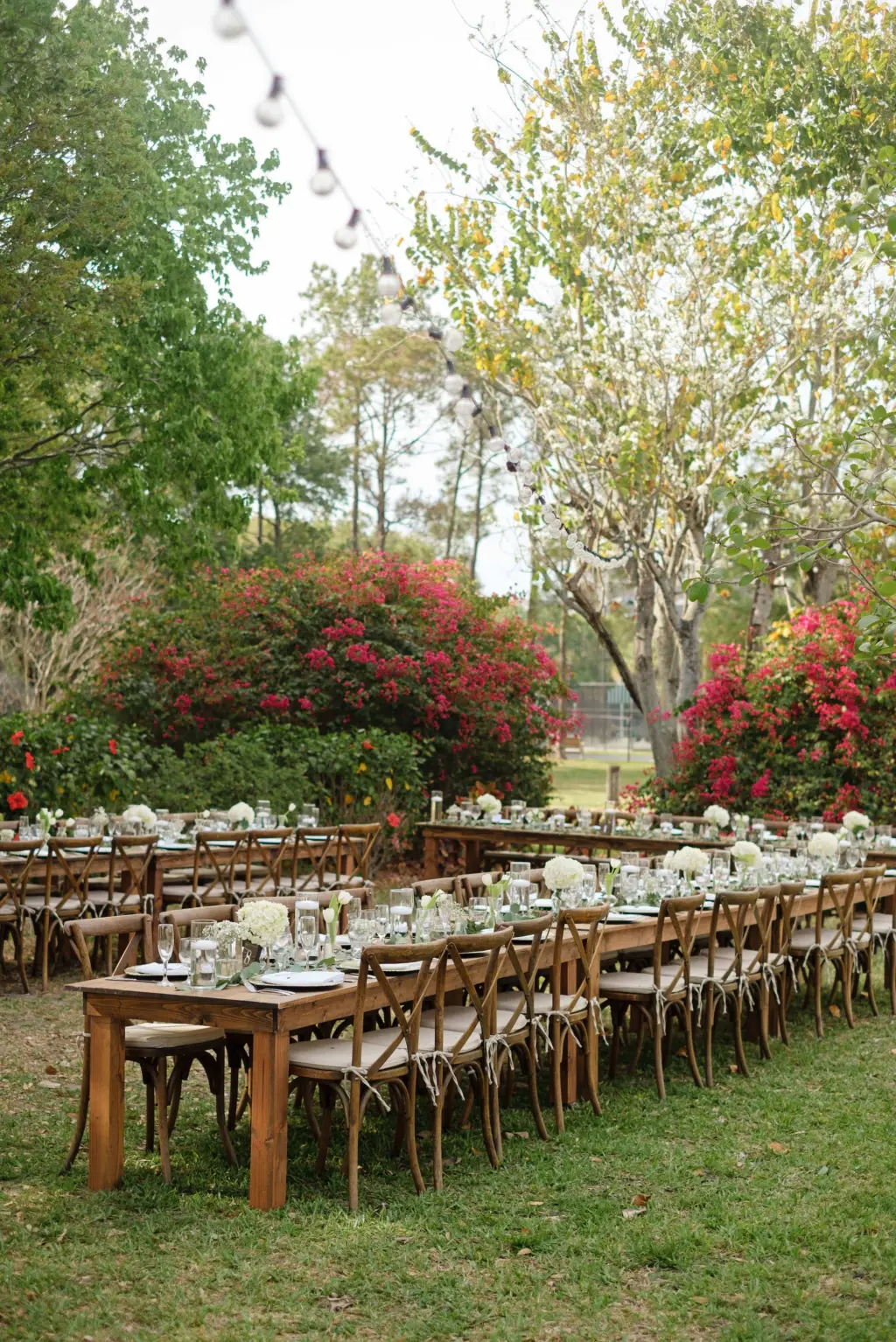 Long Feasting Tables with Wooden Crossback Chairs | Floating Candles, White Hydrangeas and Tulip Wedding Reception Centerpiece Decor | Tampa Planner The Olive Tree Weddings | Venue Davis Island Garden Club