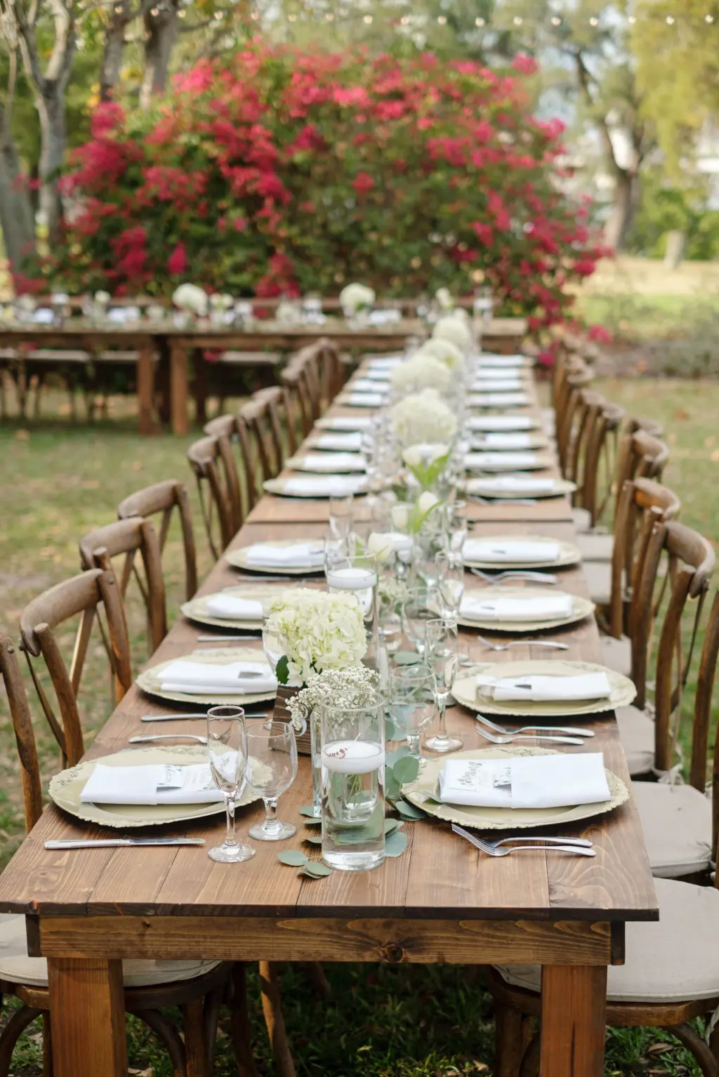 Long Feasting Tables with Wooden Crossback Chairs | Floating Candles, White Hydrangeas and Tulip Wedding Reception Centerpiece Decor | Tampa Bay Caterer Amici's Catered Cuisine
