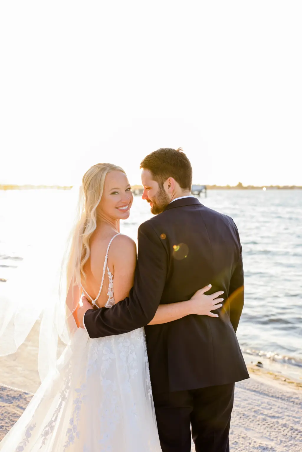 Bride and Groom Just Married Sunset Beach Wedding Portrait | St Pete Beach Photographer Lifelong Photography | Videographer Shannon Kelly Films | Planner Coastal Coordinating | Venue Isla del Sol Yacht Club