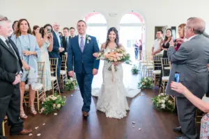 Bride Walking Down the Aisle with Father of the Bride in Indoor Intimate Romantic Wedding Ceremony