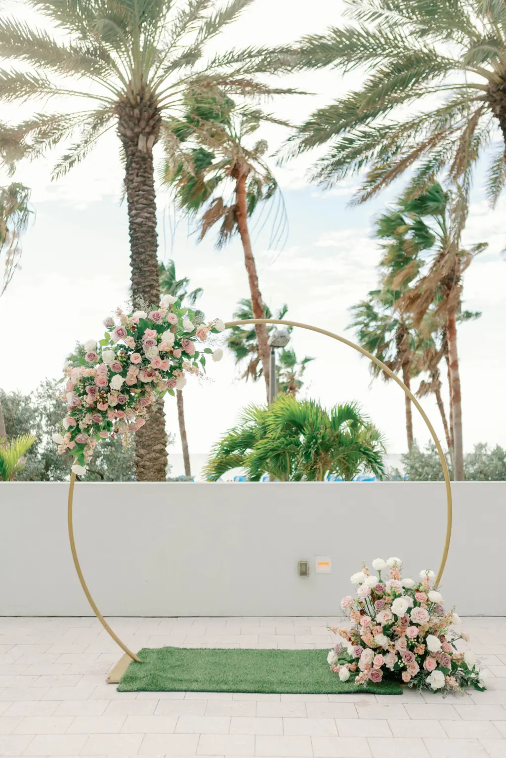 Gold Circle Wedding Arch with Mauve, Blush, and Cream Spring Wedding Floral Accents Ceremony Inspiration