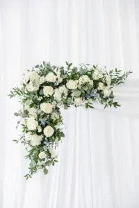 White Roses, Hydrangeas, Blue Stock Flowers, and Greenery Wedding Ceremony Arch Ideas | Tampa Bay Florist Monarch Events and Design