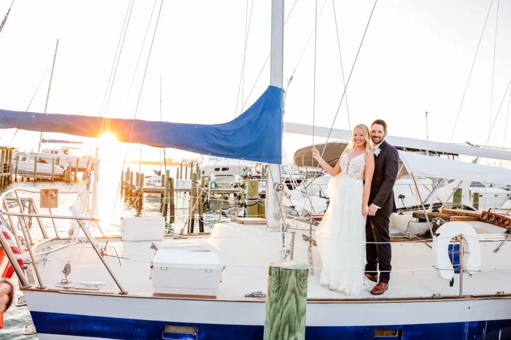 Bride and Groom On Sailboat Sunset Wedding Portrait | TSt Petersburg Photographer Lifelong Photography | Videographer Shannon Kelly Films | Planner Coastal Coordinating | Venue Isla del Sol Yacht Club