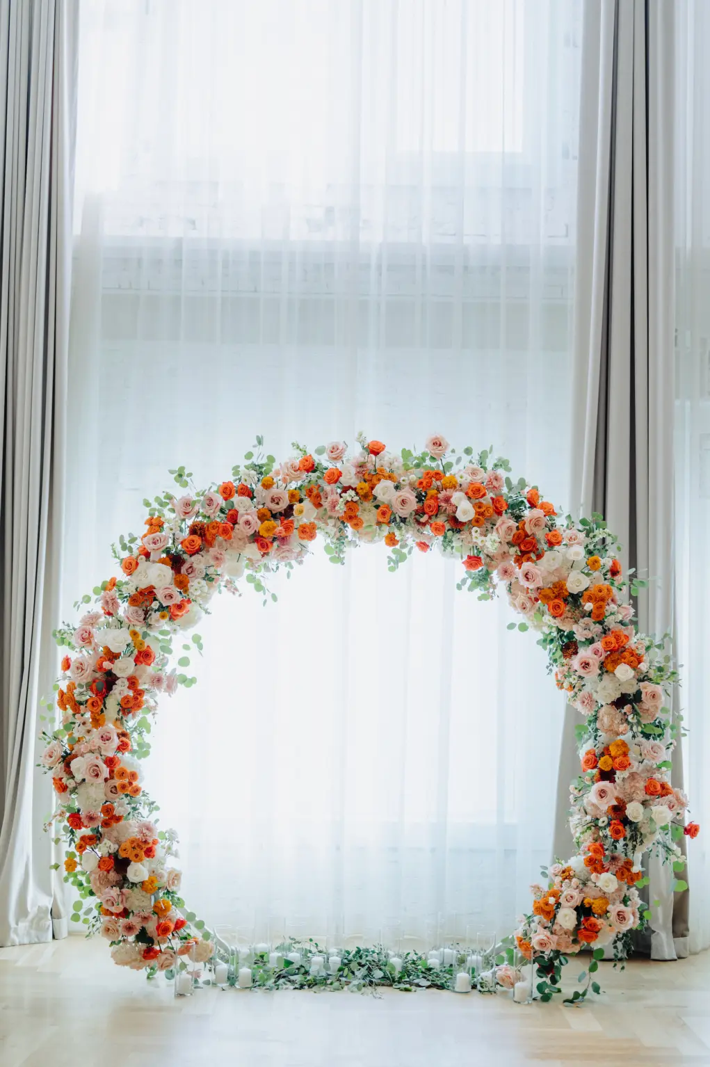 Round Orange, White, and Pink Floral Circular Arch Backdrop for Florida Wedding Ceremony