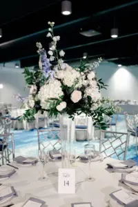 Tall Vase with White Roses, Blue Hydrangeas, Stock Flowers, and Greenery Centerpiece Inspiration