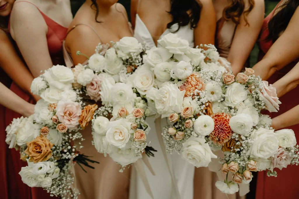 Elegant White Roses, Baby's Breath, Ranunculus, Pink Roses, and Chrysanthemums Spring Wedding Bouquet Inspiration