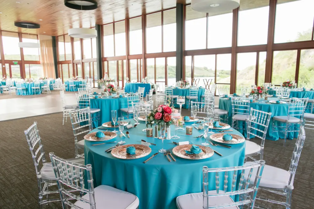 Colorful Turquoise Linen Wedding Reception with Coral Details and Ghost Chiavari Chairs | Central Florida Rentals A Chair Affair