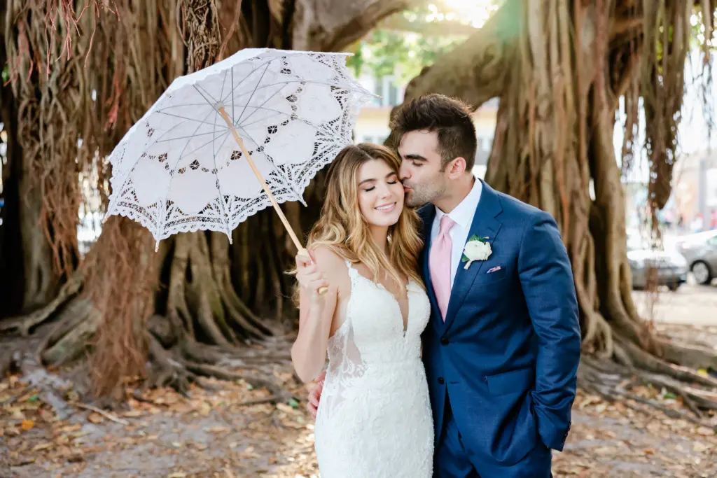 Bride and Groom Wedding Portraits In Vinoy Park with White Embroidered Umbrella | St. Pete Photographer Lifelong Photography