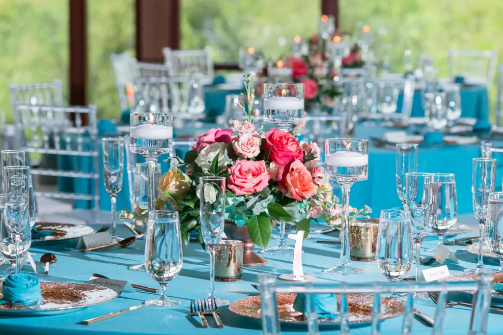 Vibrant Summer Pink and Coral Floral Centerpieces with Greenery on Turquoise Linens | Tampa Rentals A Chair Affair | Florist Monarch Events and Designs