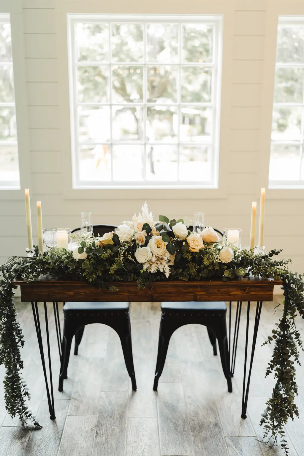 Sweetheart Head Table with Eucalyptus Greenery Garland | Taper Candles | White and Blush Roses Tabletop Flower Arrangement Ideas | Tampa Bay Florist Monarch Events and Design