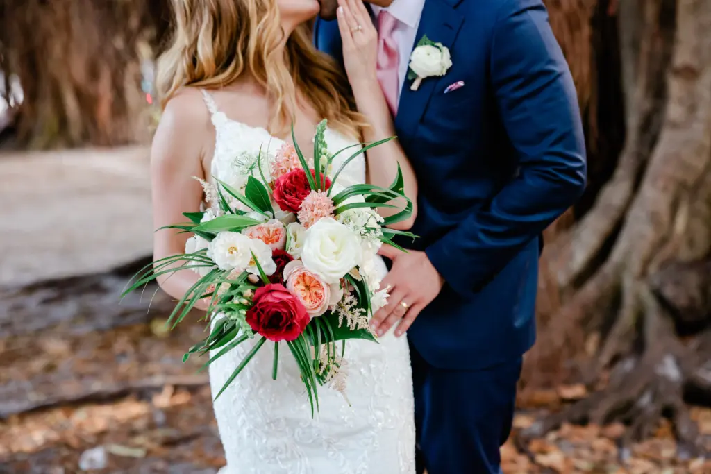 Red and Pink Tropical Floral Bridal Bouquet in Wedding Portrait | St. Petersburg Wedding Planner Coastal Coordinating
