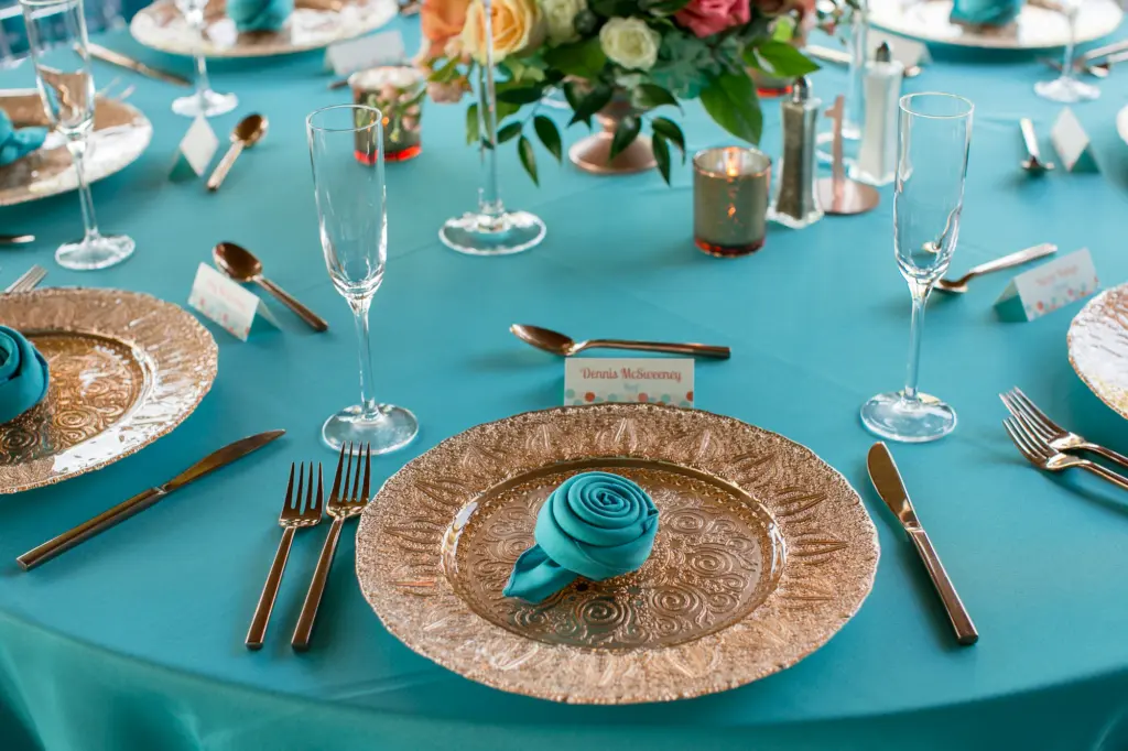 Gold Charger with Turquoise Place Setting and Linens Wedding Reception Inspiration | Central Florida Rentals A Chair Affair