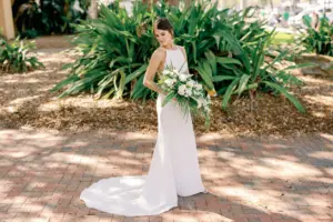Elegant High Neck A Line Simple Classic Wedding Dress with Tropical White Orchid Bridal Bouquet Wedding Inspiration | Classic Bridal Updo with Soft Glam Makeup | Tampa Wedding Hair and Makeup Artist Femme Akoi