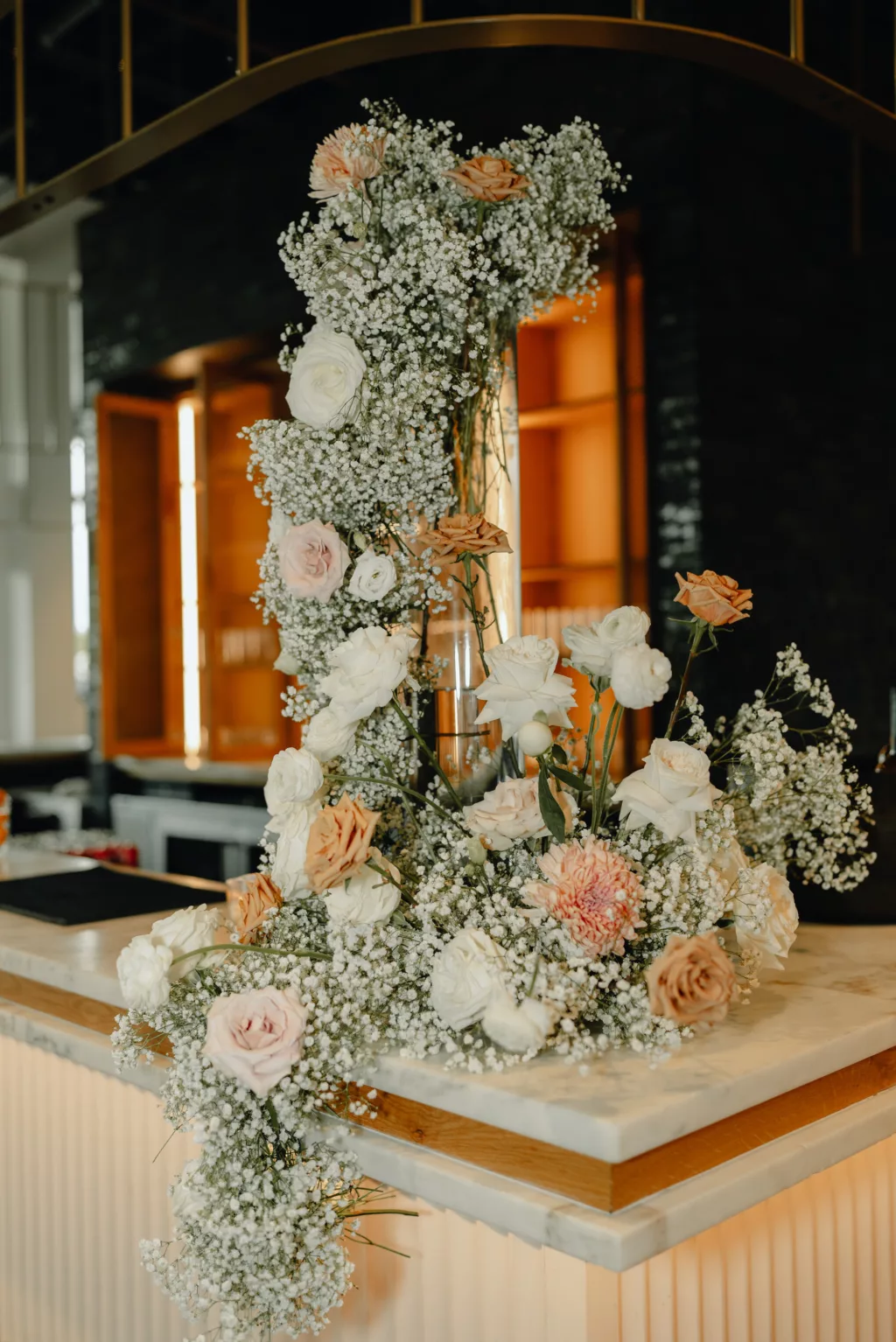 Cascading Wedding Reception Flower Arrangement Decor Ideas with Baby's Breath, White Roses, Pink Roses and Chrysanthemums